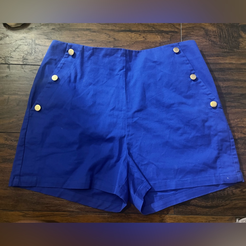 “Happily Grey” blue shorts.